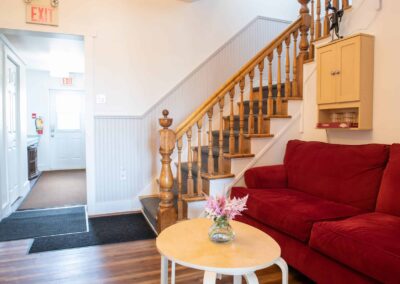 Indoor common seating area at the foot of the stairs