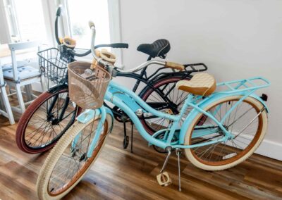 Two retro pedal bikes in the indoor dining area of Pepperell Place Inn